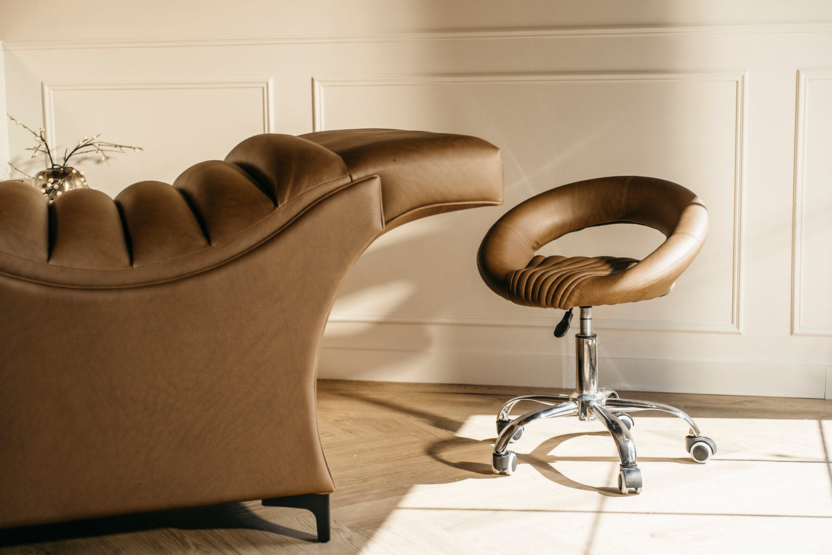 A Plush + Oak curved bed in a treatment room